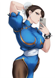 Rule 34 | 1girl, :o, arm behind head, blue dress, blueorca, bracelet, breasts, brown eyes, brown hair, bun cover, capcom, cellphone, china dress, chinese clothes, chun-li, dress, earrings, gold trim, hair bun, highres, holding, holding phone, jewelry, large breasts, looking at viewer, pantyhose, pelvic curtain, phone, sash, selfie, short hair, smartphone, solo, spiked bracelet, spikes, street fighter, thighs, white background