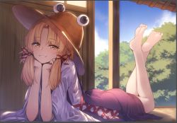 Rule 34 | 1girl, arm support, bare legs, barefoot, blonde hair, blush, brown hat, day, feet, female focus, hat, head rest, indoors, legs, lying, moriya suwako, on stomach, orange eyes, parted bangs, sai no, sky, smile, soles, solo, the pose, toes, touhou, tree, twintails