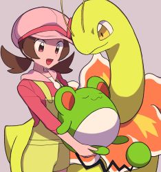 Rule 34 | 1girl, :d, alternate color, brown eyes, brown hair, cabbie hat, commentary request, creatures (company), game freak, gen 2 pokemon, green overalls, grey background, happy, hat, highres, holding, holding pokemon, long hair, looking down, lyra (pokemon), marill, meganium, nintendo, open mouth, overall shorts, overalls, pink headwear, pink shirt, pokemon, pokemon (creature), pokemon masters ex, shiny pokemon, shirt, sleeves past elbows, smile, tongue, twintails, tyako 089