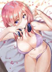 Rule 34 | 1girl, absurdres, bare shoulders, bed sheet, blue eyes, blush, bra, breasts, cleavage, closed mouth, collarbone, commentary, eyelashes, from above, go-toubun no hanayome, groin, hair between eyes, headphones, headphones around neck, highres, knees up, large breasts, long hair, looking at viewer, lying, nakano miku, navel, on back, on bed, panties, petals, pink hair, purple bra, purple panties, revision, side-tie panties, sidelocks, solo, stomach, sunhyun, underwear, underwear only, untied panties