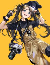 Rule 34 | 1girl, beanie, black gloves, black hair, black hat, black shirt, blue eyes, blush, brown background, camera, camera around neck, eyewear on head, fingerless gloves, gloves, goggles, hat, highres, idolmaster, idolmaster shiny colors, lifted by self, long hair, mitsumine yuika, open mouth, overalls, shirt, short sleeves, simple background, solo, ssamjang (misosan), twintails, v, very long hair, yellow background