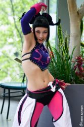 Rule 34 | 1girl, airbrushed, armpits, black hair, capcom, cosplay, cosplay photo, detached sleeves, fingerless gloves, gloves, han juri, han juri (cosplay), photo (medium), short hair, solo, street fighter, street fighter iv (series)