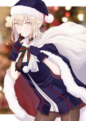 Rule 34 | 1girl, artoria pendragon (fate), black choker, blonde hair, blue dress, blue gloves, blue headwear, blush, breasts, cape, carrying bag, carrying over shoulder, choker, christmas, christmas tree, cowboy shot, dress, fate/grand order, fate (series), finger to mouth, from side, fur-trimmed cape, fur-trimmed dress, fur-trimmed headwear, fur trim, gloves, hair between eyes, highres, indoors, leaning forward, looking at viewer, medium breasts, medium hair, meltymaple, pantyhose, platinum blonde hair, pom pom (clothes), santa alter, shushing, smile, solo, yellow eyes