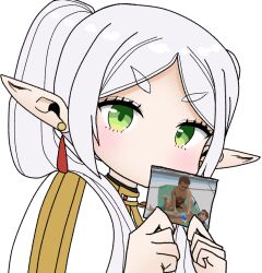 Rule 34 | 1girl, blush, commentary request, earrings, frieren, green eyes, highres, holding, holding photo, jewelry, long hair, looking at viewer, manatsu no yo no inmu, parted bangs, photo (object), pointy ears, shirt, simple background, solo, sousou no frieren, tadokoro19810, toono (coat), upper body, white background, white hair, white shirt, yajuu senpai