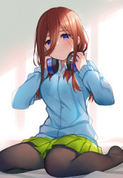 Rule 34 | 1girl, black pantyhose, blue cardigan, blue eyes, cardigan, closed mouth, commentary request, eyes visible through hair, go-toubun no hanayome, green skirt, hair between eyes, headphones, headphones around neck, highres, long sleeves, looking at viewer, meito (maze), nakano miku, pantyhose, pleated skirt, red hair, school uniform, sitting, skirt, solo, wariza