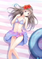 Rule 34 | 1girl, atelier (series), atelier totori, bare arms, bare shoulders, bikini, bow, breasts, brown eyes, brown hair, closed mouth, collarbone, commentary request, floral print, flower, frilled bikini, frills, hair flower, hair ornament, halterneck, hands up, hibiscus, innertube, kishida mel, long hair, looking at viewer, lying, navel, official art, on back, pink bow, polka dot, polka dot bikini, sarong, small breasts, smile, solo, stomach, striped, striped background, swim ring, swimsuit, thighs, totooria helmold