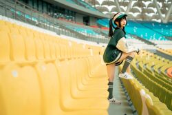 Rule 34 | 1girl, arena, asian, black hair, bottomless, chair, chinese (nationality), chunmomo0127, green baseball cap, green jacket, green socks, hat, jacket, looking at viewer, looking to the side, no pants, one leg on chair, one leg raised, oversized clothes, oversized jacket, photo (medium), real life, shoes, smile, sneakers, socks, standing, twintails, white footwear, yellow chair