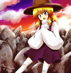 Rule 34 | 1girl, any (artist), any (lucky denver mint), blonde hair, blue eyes, english text, female focus, hair ribbon, hands in opposite sleeves, hat, moriya suwako, mountain of faith, open mouth, ribbon, solo, stone, sunset, thighhighs, touhou, turtleneck, white thighhighs, wide sleeves, zettai ryouiki
