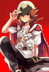 Rule 34 | 1boy, black pants, blush, brown eyes, brown hair, cape, closed mouth, hair between eyes, hand on headwear, hat, highres, kuriboh, looking at viewer, male focus, pants, red background, red cape, shirt, shoes, sitting, sk816, solo, spiked hair, t-shirt, white shirt, yu-gi-oh!, yu-gi-oh! gx, yuki judai