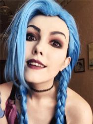 Rule 34 | 1girl, animated, animated gif, blue hair, cosplay, jinx (league of legends), league of legends, lip biting, lipstick, long hair, looking at viewer, lowres, makeup, naughty face, photo (medium), smile, twintails