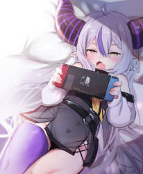 Rule 34 | 1girl, absurdres, bare shoulders, belt, blush, braid, fang, hair between eyes, highres, hololive, horns, la+ darknesss, long hair, lying, nintendo switch, on back, open mouth, pillow, pointy ears, purple hair, purple thighhighs, silver hair, single thighhigh, solo, striped horns, thighhighs, utsusumi kio, very long hair, virtual youtuber, yellow eyes
