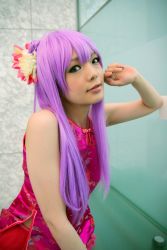 Rule 34 | 1girl, asian, bare shoulders, breasts, character request, china dress, chinese clothes, copyright request, cosplay, dress, eyeliner, flower, frills, glass wall, hair flower, hair ornament, highres, indoors, long hair, looking at viewer, makeup, mole, namada, photo (medium), pink dress, purple hair, small breasts, solo, upper body