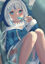Rule 34 | 1girl, animal, bloop (gawr gura), blue eyes, blue hair, blue hoodie, commentary request, couch, drawstring, food, gawr gura, gawr gura (1st costume), grey hair, haro art, highres, holding, holding food, hololive, hololive english, hood, hood up, hoodie, looking at viewer, multicolored hair, on couch, pillow, popsicle, shark, solo focus, streaked hair, virtual youtuber