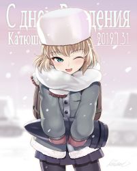 Rule 34 | 1girl, artist name, backpack, bag, black pantyhose, blizzard, blonde hair, blue eyes, blue skirt, blurry, blurry background, blush, casual, character name, coat, commentary, cyrillic, dated, fang, fringe trim, fur hat, girls und panzer, grey coat, half-closed eye, hat, holding, kasai shin, katyusha (girls und panzer), long sleeves, looking at viewer, miniskirt, mittens, one eye closed, open mouth, outdoors, pantyhose, pleated skirt, purple mittens, russian text, scarf, short hair, signature, skirt, smile, snow, solo, standing, tank shell, ushanka, white hat, white scarf