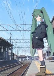 Rule 34 | 1girl, black jacket, black socks, boots, building, commentary, day, from side, furuyama itaru, green eyes, green hair, hair ornament, hands in pocket, hatsune miku, jacket, kneehighs, light blush, long hair, looking to the side, outdoors, power lines, railroad tracks, socks, solo, standing, tactile paving, train station, twintails, very long hair, vocaloid