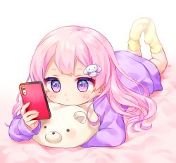Rule 34 | 1girl, bad id, bad pixiv id, bed sheet, blush, rabbit hair ornament, cellphone, closed mouth, fingernails, hair ornament, holding, holding phone, komachi pochi, legs up, long hair, long sleeves, looking away, lying, no shoes, on stomach, original, phone, pink hair, purple eyes, purple shirt, shirt, sleeves past wrists, socks, soles, solo, yellow socks