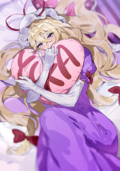 Rule 34 | 1girl, absurdres, blonde hair, blurry, character name, commentary, depth of field, dress, elbow gloves, english commentary, gloves, gunnjou yosio, heart, heart-shaped pillow, highres, long hair, looking at viewer, low-tied long hair, hugging object, on bed, pillow, pillow hug, pink eyes, purple dress, short sleeves, solo, touhou, white gloves, yakumo yukari