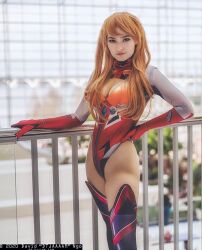 Rule 34 | 1girl, adapted costume, bodysuit, breasts, brown hair, cleavage, cleavage cutout, clothing cutout, cosplay, curvy, dated, hand on own hip, highleg, highleg leotard, highres, leotard, long hair, looking at viewer, medium breasts, neon genesis evangelion, omgcosplay, photo (medium), plugsuit, real life, rebuild of evangelion, red leotard, shiny clothes, simple background, skin tight, skindentation, solo, souryuu asuka langley, souryuu asuka langley (cosplay), standing, thighhighs, thong leotard