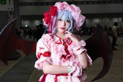 Rule 34 | 1girl, absurdres, ascot, bat wings, blue hair, bow, brooch, closed mouth, collared shirt, comiket 103, cosplay, cosplay photo, frilled shirt collar, frills, hair between eyes, hat, highres, indoors, jewelry, looking at viewer, medium hair, mob cap, nocomof, photo (medium), pink hat, pink shirt, red ascot, red bow, red brooch, red eyes, remilia scarlet, shirt, sleeve bow, solo focus, touhou, wings, wrist cuffs