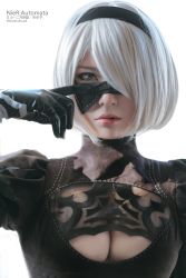 Rule 34 | 1girl, asian, blindfold, blue eyes, breasts, cleavage cutout, clothing cutout, cosplay, dress, gloves, hairband, highres, lips, looking at viewer, mole, mole under mouth, nier (series), nier:automata, photo (medium), pink lips, short hair, solo, white hair, 2b (nier:automata)