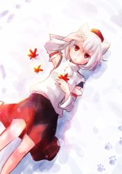 Rule 34 | 1girl, animal ears, arm up, cowboy shot, detached sleeves, hand on own head, hat, highres, holding, holding leaf, inubashiri momiji, kanno fumiroku, leaf, looking at viewer, lying, maple leaf, on back, open mouth, paw print, pom pom (clothes), red eyes, short hair, skirt, smile, snow, snowing, solo, tail, tokin hat, touhou, white hair, wolf ears, wolf tail