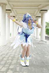 Rule 34 | 1girl, ankle boots, arm up, asian, blue eyes, blue hair, boots, bow, bracelet, breasts, choker, chouzuki maryou, cosplay, cure diamond (cosplay), dokidoki! precure, dress, headpiece, highres, jewelry, large breasts, long hair, magical girl, matching hair/eyes, photo (medium), plump, ponytail, precure, puffy short sleeves, puffy sleeves, ribbon, short sleeves, solo, tiara, v