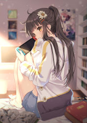 Rule 34 | 1girl, ahoge, barefoot, black hair, blue shorts, blurry, blurry background, book, brown eyes, commentary, depth of field, flower, from behind, hair flower, hair ornament, hairclip, highres, holding, jacket, knees up, long hair, long sleeves, looking at viewer, looking back, nintendo switch, original, picture frame, ponytail, rosuuri, short shorts, shorts, sidelocks, sitting, solo, thighs, white jacket