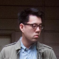 Rule 34 | 1boy, albert yi, asian, black hair, blue shirt, closed mouth, collared jacket, collared shirt, danbooru (site), film grain, frown, glasses, grey jacket, jacket, lowres, male focus, open clothes, open jacket, photo (medium), real life, shirt, short hair, solo, upper body
