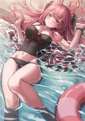 1girl absurdres alternate_costume aru_(blue_archive) beach bikini black_bikini black_shirt blue_archive blush bracelet closed_mouth demon_girl demon_horns hair_between_eyes highres horns in_water jewelry long_hair looking_at_viewer lowleg lowleg_bikini lying on_back red_hair ryon_y0421 shirt sidelocks swim_ring swimsuit tankini yellow_eyes