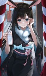 Rule 34 | 1girl, animal ears, black hair, black kimono, blue bow, blue eyes, blue sash, blush, bow, breasts, chie (user snfh8333), closed mouth, commentary, cowboy shot, floral print, flower knot, fur scarf, hair behind ear, tucking hair, hands up, highres, holding, japanese clothes, kimono, long hair, looking at viewer, medium breasts, mole, mole under eye, obi, omikuji, original, outdoors, print kimono, rabbit ears, sash, sidelocks, smile, solo, symbol-only commentary, tassel, torii, wide sleeves