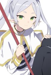 Rule 34 | 1girl, aki poi, black pantyhose, blush, capelet, closed mouth, commentary request, earrings, elf, feet out of frame, frieren, grey hair, hand on own knee, holding, jewelry, knees up, long hair, looking at viewer, pantyhose, pointy ears, shirt, simple background, skirt, smile, solo, sousou no frieren, striped clothes, striped shirt, twintails, white background, white capelet, white skirt