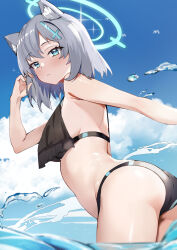 Rule 34 | 1girl, absurdres, animal ear fluff, animal ears, ass, blue archive, blue eyes, blush, breasts, cross hair ornament, extra ears, grey hair, hair ornament, halo, highres, looking at viewer, medium breasts, medium hair, mismatched pupils, nohohon neko, outdoors, shiroko (blue archive), solo, swimsuit, thighs, wading, water, wolf ears