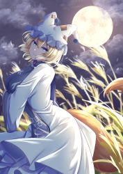 Rule 34 | 1girl, animal hat, blonde hair, blue eyes, breasts, closed mouth, cloud, dress, fox tail, from side, full moon, hat, highres, large breasts, long sleeves, looking at viewer, mirufui, mob cap, moon, multiple tails, night, outdoors, own hands together, short hair, smile, solo, standing, tabard, tail, touhou, wheat, wheat field, white dress, white hat, wide sleeves, wind, yakumo ran