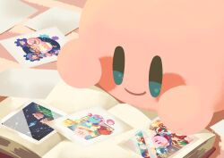 Rule 34 | blue eyes, blush stickers, book, carpet, closed mouth, colored skin, commentary request, hitofutarai, indoors, kirby, kirby: planet robobot, kirby (series), kirby 64, kirby air ride, kirby super star, lying, nintendo, no humans, on stomach, open book, photo (object), photo album, pink skin, smile, solo