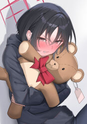 1girl black_hair black_hoodie blue_archive blush grey_background halo highres hood hood_down hoodie hugging_doll hugging_object long_sleeves looking_at_viewer misaki_(blue_archive) red_eyes short_hair shougun_(chuckni1) simple_background solo stuffed_animal stuffed_toy teddy_bear upper_body