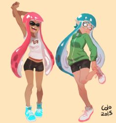 Rule 34 | 2girls, arms up, bespectacled, bike shorts, blue hair, breasts, clothes writing, colo (nagrolaz), dark-skinned female, dark skin, fangs, full body, glasses, green shirt, inkling, inkling girl, inkling player character, jacket, long hair, multiple girls, nintendo, orange eyes, pink hair, pointy ears, shirt, shoes, short hair with long locks, simple background, small breasts, sneakers, splatoon (series), splatoon 1, stretching, t-shirt, tentacle hair, track jacket, twintails