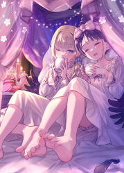 2girls bare_legs barefoot black_feathers black_wings blonde_hair blue_eyes candle closed_eyes collarbone cup feathered_wings feathers feet food hairband highres holding holding_cup kanipanda lingerie low_wings macaron multiple_girls negligee one_eye_closed original purple_hair short_hair sitting soles teapot toenails toes underwear wings yuri