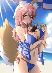 Rule 34 | animal ears, beach, beach towel, between breasts, bikini, blue bikini, blush, breasts, commentary request, day, fate/grand order, fate (series), fox ears, fox tail, large breasts, long hair, masuishi kinoto, mouth hold, pink hair, solo, swimsuit, tail, tamamo (fate), tamamo no mae (fate/extra), tamamo no mae (swimsuit lancer) (fate), towel, yellow eyes
