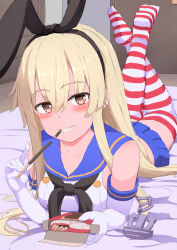 Rule 34 | 1girl, anchor hair ornament, black hairband, black neckerchief, blonde hair, blue sailor collar, blue skirt, brown eyes, commentary request, crop top, elbow gloves, food, gloves, hair ornament, hairband, highres, kantai collection, long hair, looking at viewer, lying, microskirt, miniskirt, neckerchief, on stomach, pleated skirt, pocky, sailor collar, shimakaze (kancolle), shirt, skirt, sleeveless, sleeveless shirt, soles, solo, striped clothes, striped thighhighs, thighhighs, tsukimoto reiji, white gloves