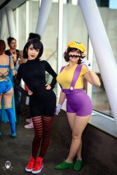 Rule 34 | 2girls, black hair, black lips, blurry, blurry background, breasts, brown hair, bunnyayu, cosplay, facial hair, fake ears, full body, gloves, hands on own hips, hotel transylvania, large breasts, mario (series), mavis dracula, multiple girls, mustache, nintendo, overalls, serious, shoes, shorts, smile, sneakers, susu jpg, thighhighs, wario