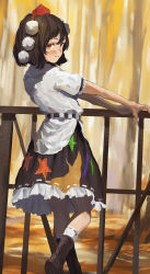 Rule 34 | 1girl, black hair, black skirt, blouse, blush, boots, brown footwear, closed mouth, fjsmu, frilled skirt, frilled sleeves, frills, from behind, from side, hat, highres, kneehighs, looking at viewer, looking back, multicolored clothes, multicolored skirt, no wings, orange eyes, outstretched arms, pom pom (clothes), railing, red hat, ribbon-trimmed skirt, ribbon trim, shameimaru aya, shirt, short hair, skirt, smile, socks, solo, standing, standing on one leg, star (symbol), tokin hat, touhou, unconnected marketeers, white shirt, white socks