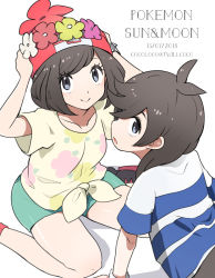Rule 34 | 1boy, 1girl, beanie, black hair, cocoloco, creatures (company), dated, elio (pokemon), floral print, game freak, green shorts, hat, head wreath, nintendo, pokemon, pokemon sm, red headwear, selene (pokemon), shirt, short hair, short sleeves, shorts, simple background, sitting, smile, striped clothes, striped shirt, tied shirt, white background, z-ring