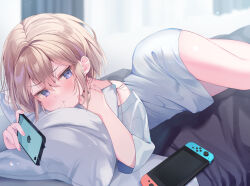 Rule 34 | 1girl, bare shoulders, bed, blue eyes, blurry, blurry background, blush, brown hair, cellphone, closed mouth, commentary request, curtains, day, depth of field, ebihara beniko, hair between eyes, hair in own mouth, holding, holding phone, indoors, long sleeves, lying, nail polish, nintendo switch, off shoulder, on bed, on side, original, phone, pillow, pink nails, shirt, solo, white shirt