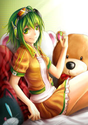 Rule 34 | &gt;:), 1girl, digital media player, goggles, gradient background, green eyes, green hair, gumi, headphones, highres, ipod, ipod shuffle, jacket, jurrig, looking at viewer, matching hair/eyes, open clothes, open jacket, orange shirt, orange skirt, shirt, short sleeves, sitting, skirt, smile, solo, stuffed animal, stuffed toy, v-shaped eyebrows, vocaloid, white shirt