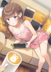 Rule 34 | 1girl, barefoot, blue eyes, blush, brown hair, commentary request, couch, cup, cushion, from above, handheld game console, highres, holding, holding cup, holding handheld game console, knees together feet apart, latte art, long hair, looking at viewer, lying, nightgown, nintendo switch, no bra, on couch, on side, open mouth, original, pink nightgown, playing games, pov, pov hands, ruien (wu jui-en), solo focus, wooden floor