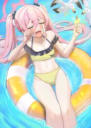 Rule 34 | 1girl, afloat, bird, blue archive, blush, cafenami, closed eyes, commentary request, crying, food, halo, hand on own face, highres, holding, holding food, holding popsicle, innertube, koyuki (blue archive), millennium science school logo, navel, open mouth, pink hair, popsicle, popsicle stick, seagull, solo, swim ring, swimsuit, tearing up, twintails, water