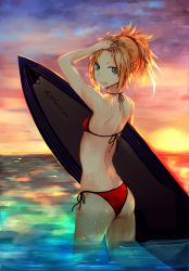 Rule 34 | 1girl, ass, bikini, blonde hair, fate/apocrypha, fate/grand order, fate (series), female focus, front-tie top, green eyes, hair pulled back, halterneck, highres, holding, holding own hair, kaze minoru so-ru, looking at viewer, looking back, mordred (fate), mordred (fate) (all), mordred (fate/apocrypha), mordred (swimsuit rider) (fate), mordred (swimsuit rider) (first ascension) (fate), open mouth, orange sky, orange theme, partially submerged, red bikini, side-tie bikini bottom, sky, solo, sunset, surfboard, swimsuit, wading, water