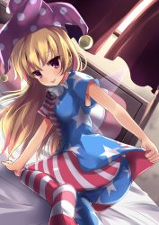 Rule 34 | 1girl, american flag dress, american flag legwear, ass, bed, bed frame, bed sheet, bent over, blonde hair, breasts, clothes lift, clownpiece, curtains, dress, dress lift, fairy wings, hat, highres, jester cap, long hair, looking back, pantyhose, perspective, pillow, purple eyes, shirt lift, short sleeves, small breasts, solo, soramuko, tongue, tongue out, touhou, wind, window, wings
