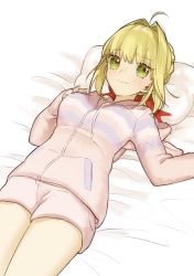 Rule 34 | 1girl, ahoge, akamakoto, blonde hair, blush, braid, breasts, fate/extra, fate (series), french braid, green eyes, hair between eyes, hair bun, hair intakes, large breasts, long hair, long sleeves, looking at viewer, lying, nero claudius (fate), nero claudius (fate) (all), nero claudius (fate/extra), on back, pillow, shorts, single hair bun, smile, sweater, thighs