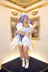 Rule 34 | 1girl, ankle boots, arm rest, asian, blue eyes, blue hair, boots, bow, bracelet, breasts, choker, chouzuki maryou, cosplay, cure diamond (cosplay), dancing, dokidoki! precure, dress, headpiece, highres, jewelry, large breasts, long hair, magical girl, matching hair/eyes, photo (medium), plump, pointing, ponytail, precure, puffy short sleeves, puffy sleeves, ribbon, short sleeves, solo, tiara
